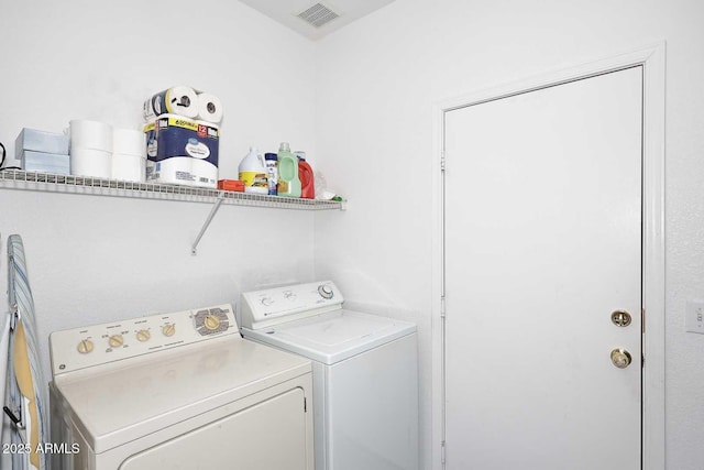 washroom featuring washer and dryer