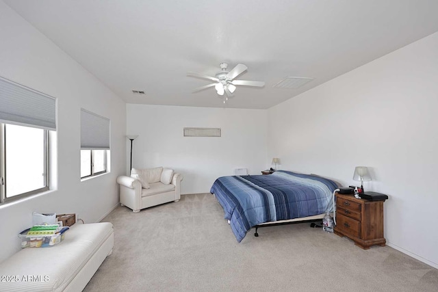 bedroom featuring light carpet and ceiling fan