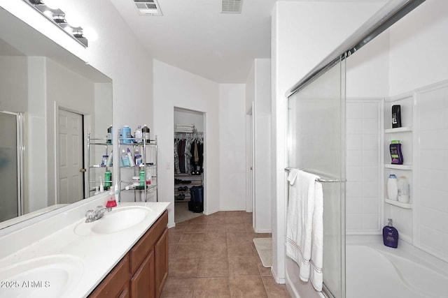 bathroom featuring vanity, tile patterned floors, and separate shower and tub