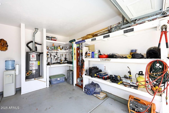 garage featuring water heater and a workshop area