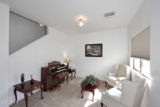 living area featuring light colored carpet