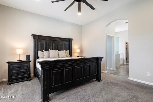 24403 N 43rd Dr, Glendale, AZ 85310 - bedroom with baseboards, a ceiling fan, visible vents, arched walkways, and light colored carpet