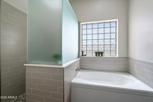 24403 N 43rd Dr, Glendale, AZ 85310 - full bathroom with walk in shower, tile walls, a garden tub, and a wainscoted wall