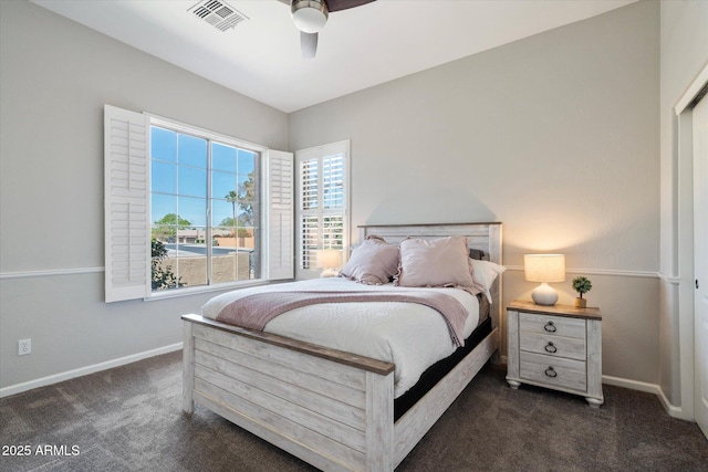 24403 N 43rd Dr, Glendale, AZ 85310 - bedroom with baseboards, dark colored carpet, a ceiling fan, and visible vents