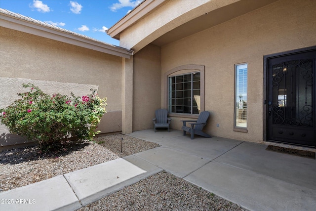 24403 N 43rd Dr, Glendale, AZ 85310 - property entrance featuring a patio and stucco siding