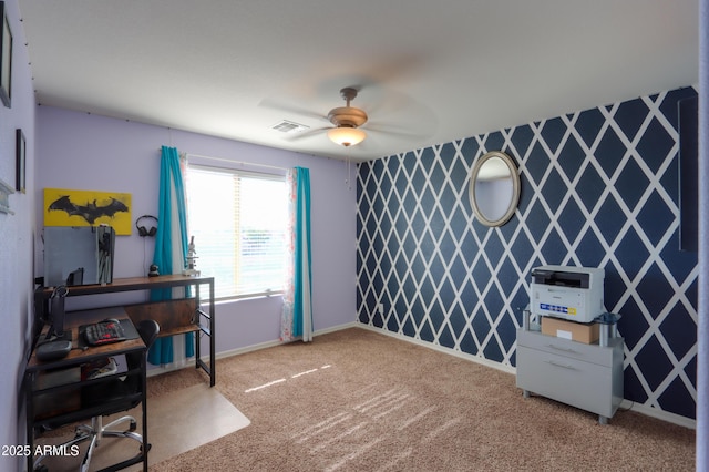 interior space featuring baseboards, carpet, a ceiling fan, and visible vents