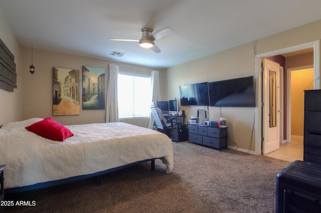 bedroom featuring visible vents, carpet, and ceiling fan