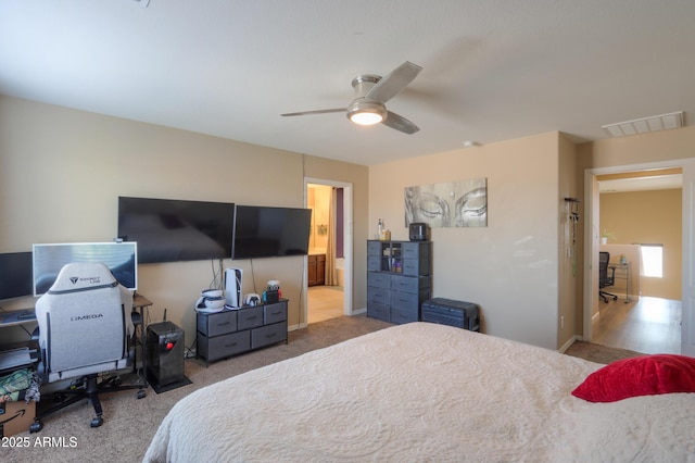 bedroom featuring carpet flooring, baseboards, visible vents, and connected bathroom