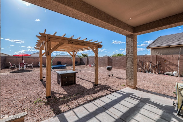 view of patio featuring a pergola and a fenced backyard