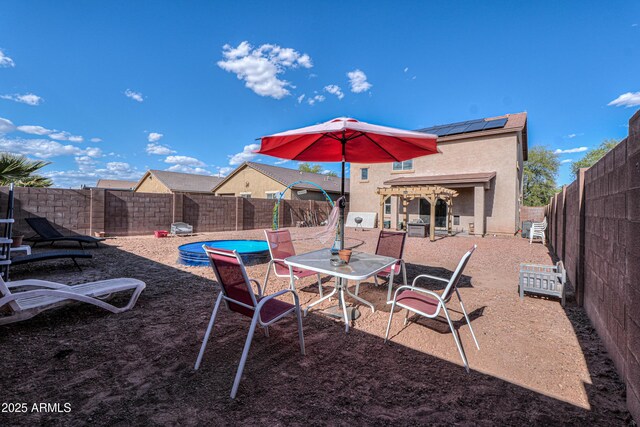 view of yard featuring a fenced backyard, a fenced in pool, and a patio