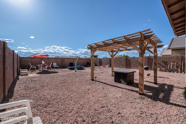view of yard featuring a fenced backyard and a pergola