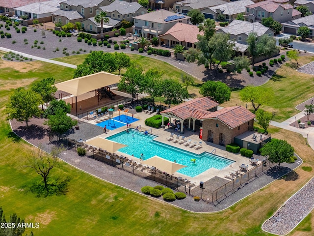 birds eye view of property with a residential view