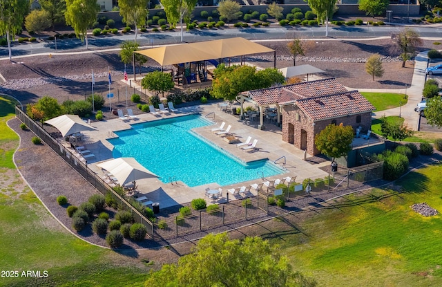 pool featuring a patio, fence, and a pergola