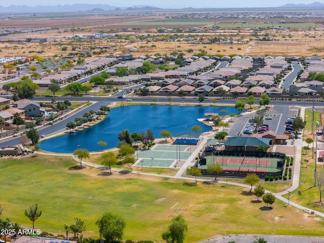 drone / aerial view with a water and mountain view