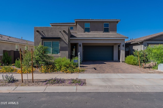 22822 E Watford Dr, Queen Creek, AZ 85142 - view of front facade featuring stucco siding, decorative driveway, and an attached garage