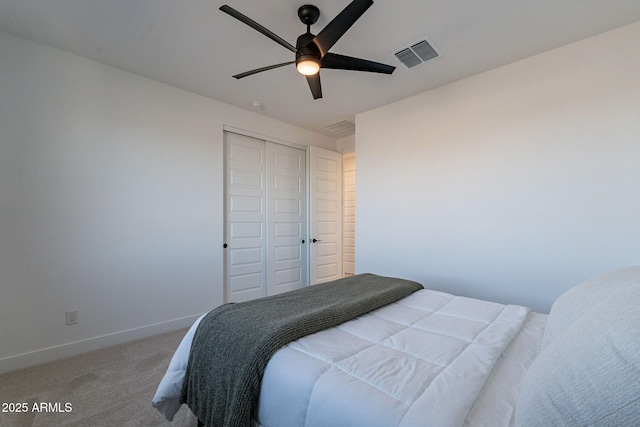 22822 E Watford Dr, Queen Creek, AZ 85142 - carpeted bedroom with a closet, visible vents, ceiling fan, and baseboards