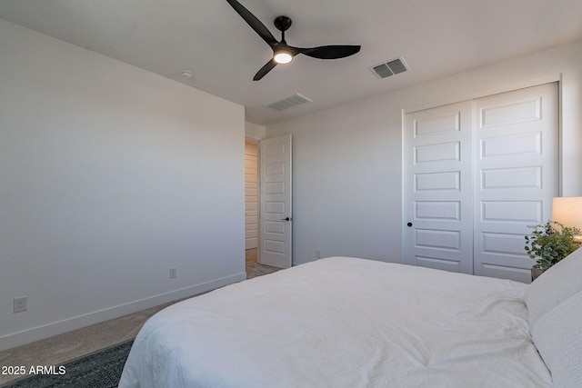 22822 E Watford Dr, Queen Creek, AZ 85142 - carpeted bedroom with baseboards, visible vents, a ceiling fan, and a closet