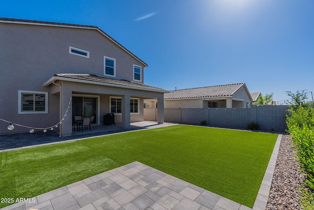 22822 E Watford Dr, Queen Creek, AZ 85142 - back of house featuring a patio, a fenced backyard, stucco siding, and a lawn