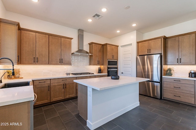 22822 E Watford Dr, Queen Creek, AZ 85142 - kitchen with a sink, stainless steel appliances, visible vents, backsplash, and wall chimney range hood