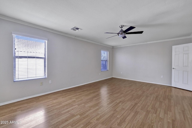 1090 S Bogle Ct, Chandler, AZ 85286 - spare room with plenty of natural light, crown molding, wood finished floors, and a ceiling fan