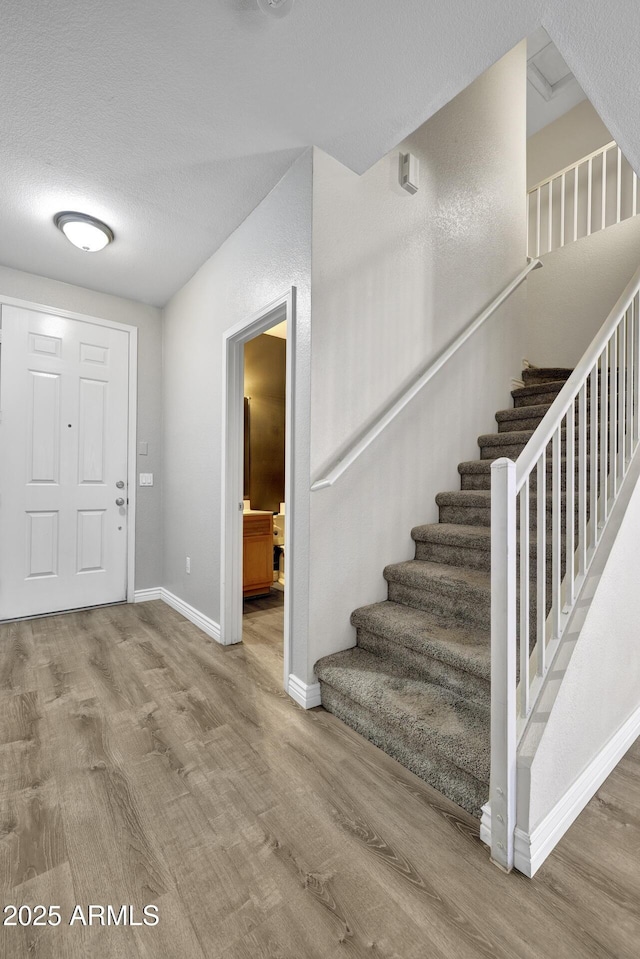 1090 S Bogle Ct, Chandler, AZ 85286 - foyer entrance featuring wood finished floors and stairway