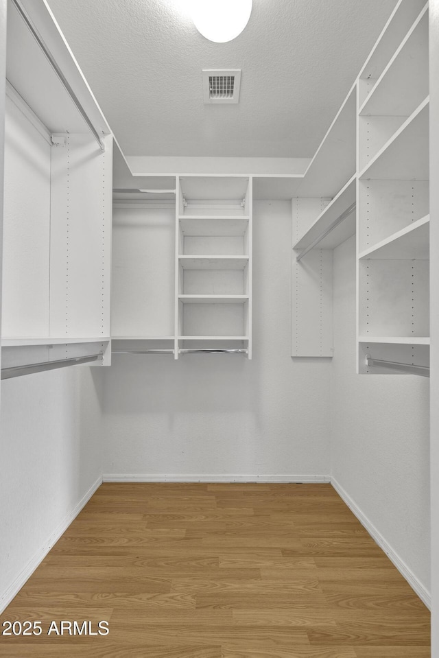 1090 S Bogle Ct, Chandler, AZ 85286 - spacious closet featuring wood finished floors