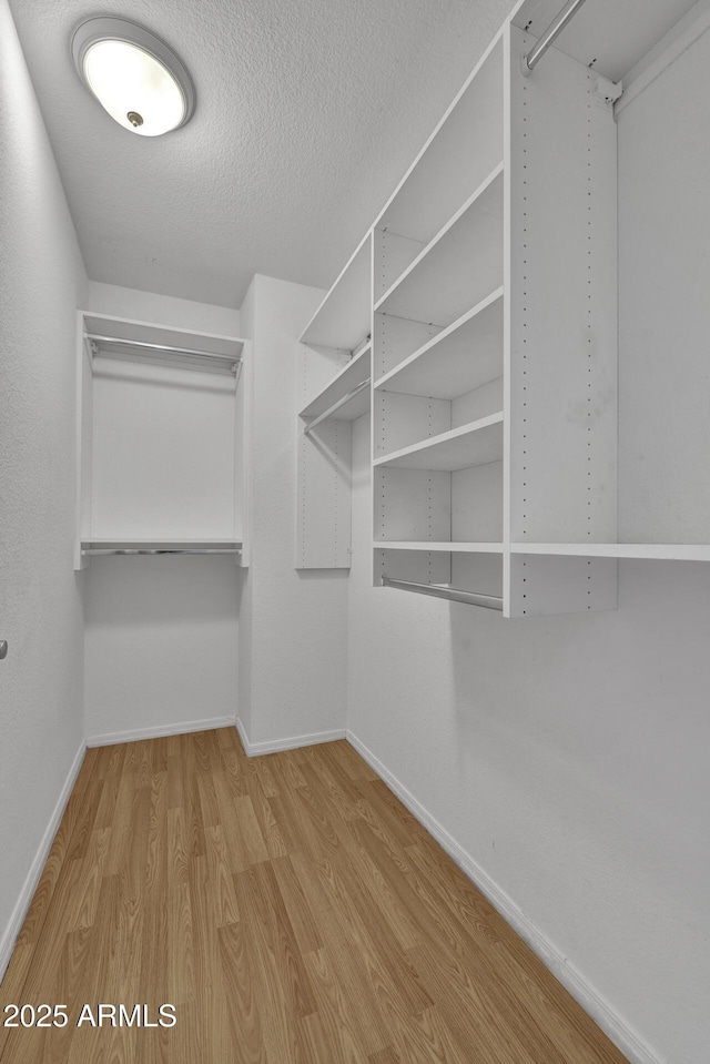 1090 S Bogle Ct, Chandler, AZ 85286 - spacious closet featuring wood finished floors