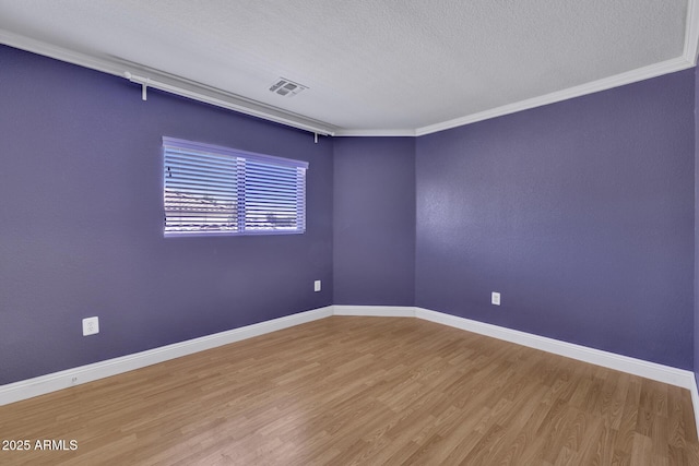 1090 S Bogle Ct, Chandler, AZ 85286 - spare room featuring wood finished floors, a textured ceiling, and crown molding