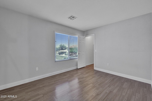 1090 S Bogle Ct, Chandler, AZ 85286 - empty room with wood finished floors and baseboards