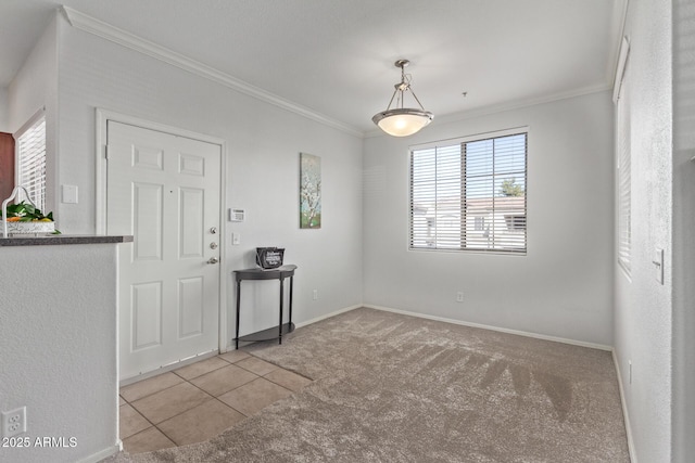 carpeted spare room featuring crown molding