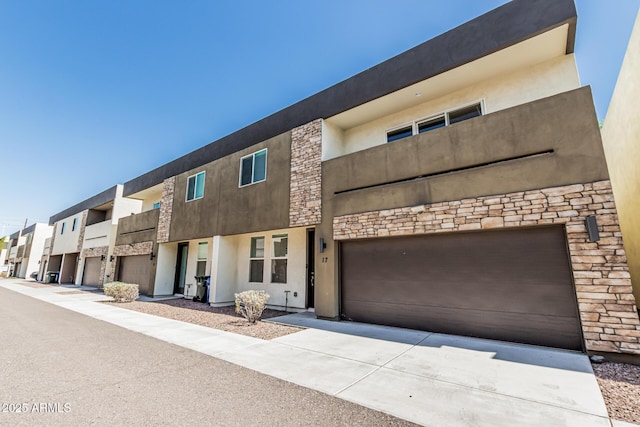 2000 N 36th St Unit 17, Phoenix, AZ 85008 - view of front of property with stucco siding, driveway, and an attached garage