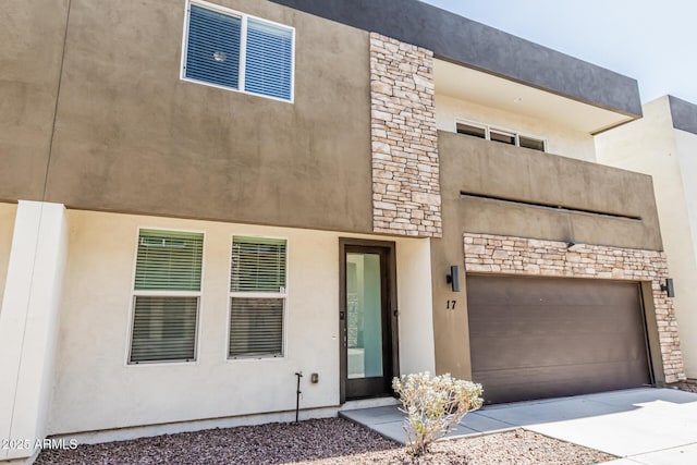 2000 N 36th St Unit 17, Phoenix, AZ 85008 - view of front of home featuring stone siding, concrete driveway, and stucco siding