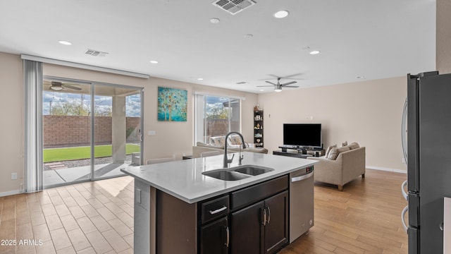 kitchen with a sink, visible vents, appliances with stainless steel finishes, and ceiling fan