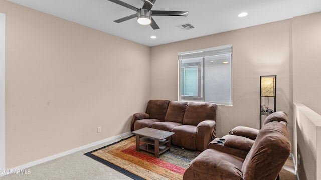 carpeted living area featuring recessed lighting, baseboards, visible vents, and ceiling fan