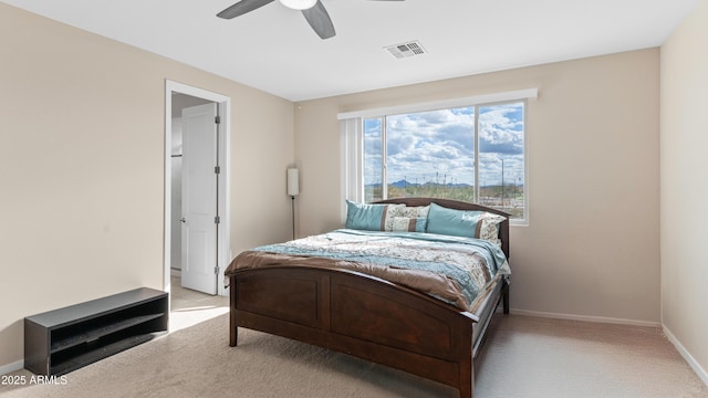 bedroom featuring visible vents, baseboards, carpet, and a ceiling fan