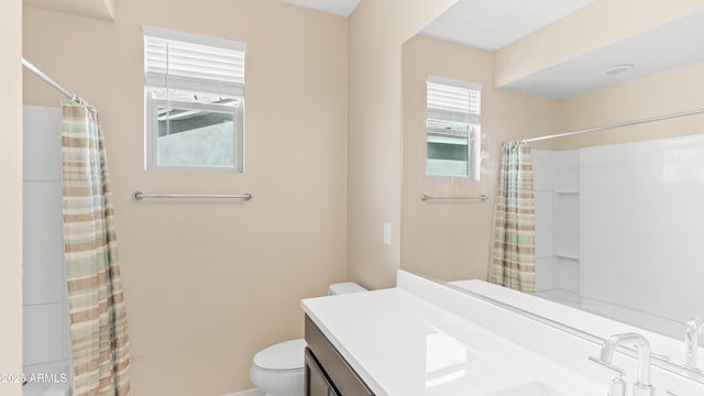 full bathroom featuring a shower with curtain, toilet, a healthy amount of sunlight, and vanity