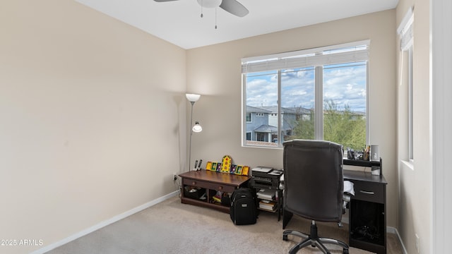 office area featuring baseboards, carpet, and a ceiling fan