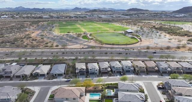 bird's eye view featuring a mountain view and a residential view