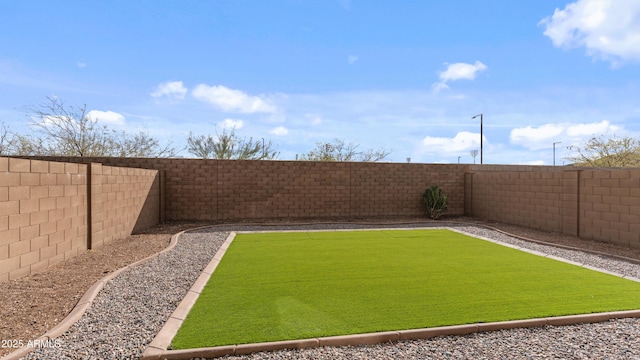 view of yard featuring a fenced backyard