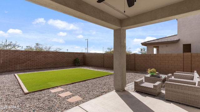 view of yard with ceiling fan, a patio, and a fenced backyard