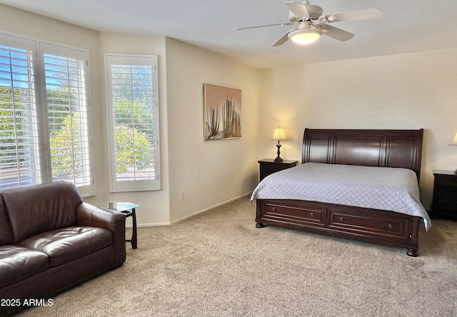 bedroom featuring light carpet and ceiling fan