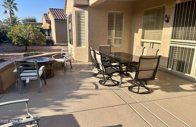 view of patio / terrace featuring an outdoor fire pit