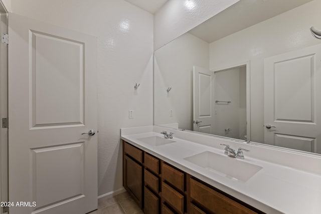 bathroom featuring tile patterned floors, vanity, and toilet