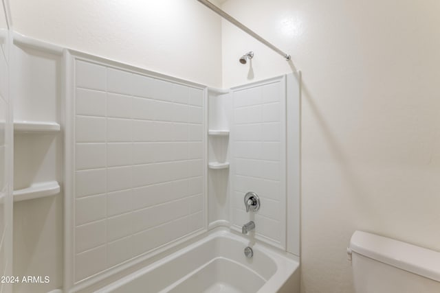 bathroom featuring shower / bath combination and toilet