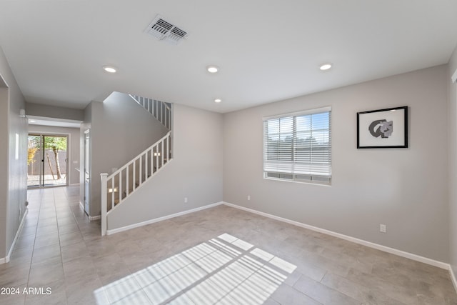 spare room featuring light tile patterned floors