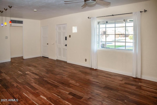 foyer entrance with dark wood-type flooring and ceiling fan