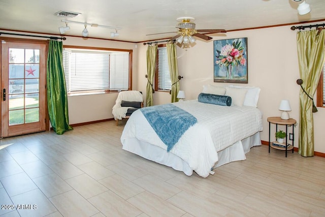 bedroom featuring ceiling fan and rail lighting