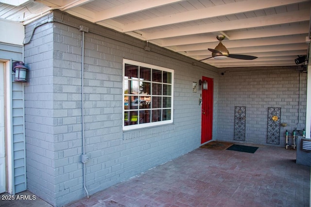 property entrance featuring ceiling fan and a patio