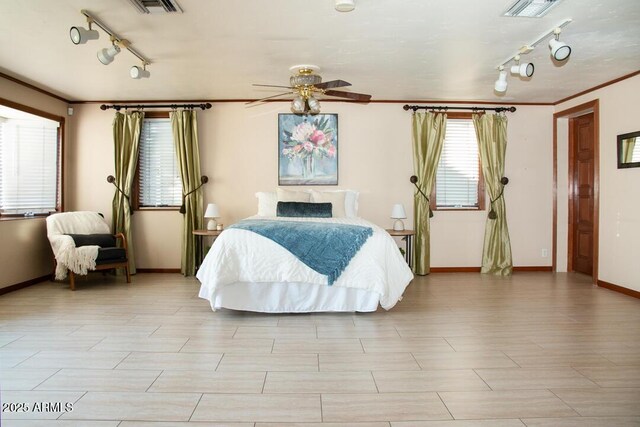 bedroom featuring ceiling fan and crown molding