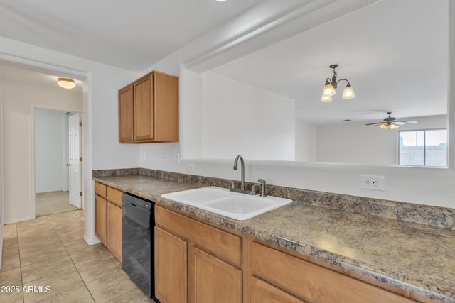 kitchen featuring light tile patterned floors, black dishwasher, a sink, dark countertops, and ceiling fan with notable chandelier
